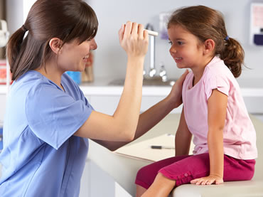 Doctor examining child